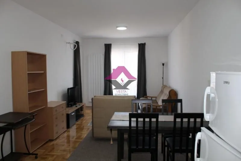 Living room with a dining table and furniture.