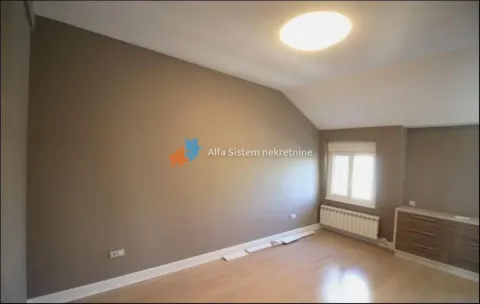 Empty room with parquet flooring and a sloped ceiling. - image 12