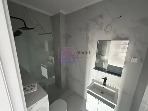 Modernly equipped bathroom with a walk-in shower and a vanity unit. - image 5