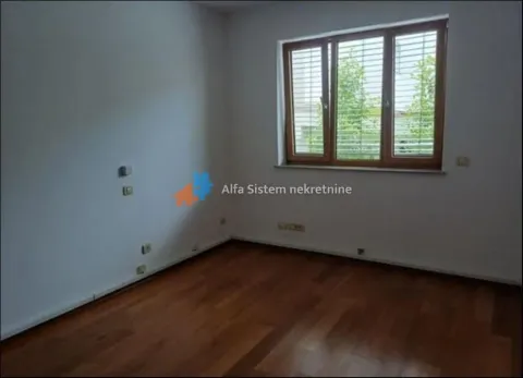 Empty room with wooden flooring and a window. - image 16