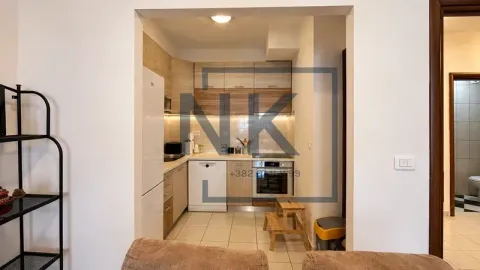 View from the living room into the equipped kitchen. - image 5