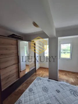 Bedroom with a large wardrobe and a bed. - image 9