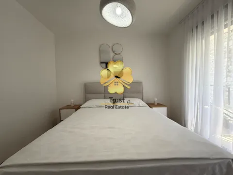 Bright bedroom with a double bed and bedside tables. - image 9