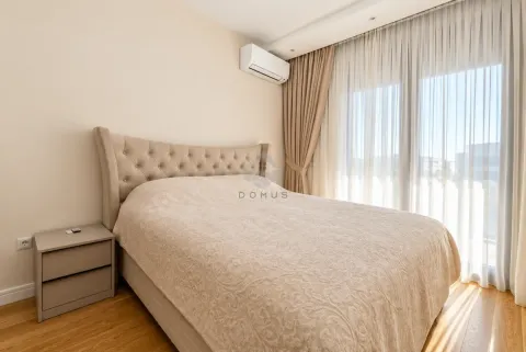 Spacious bedroom with a double bed, nightstand, and access to the terrace. - image 21