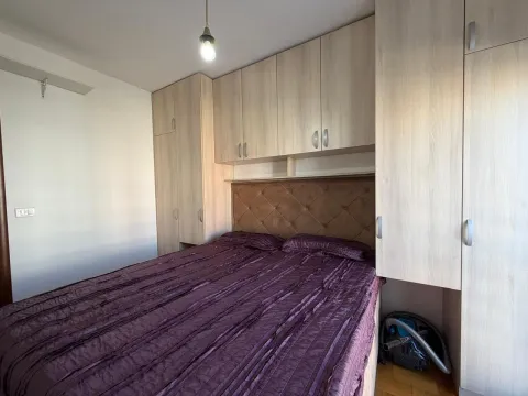 Furnished bedroom with a double bed and built-in wardrobes. - image 10