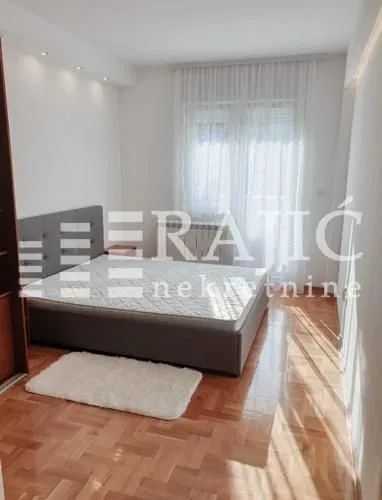 Furnished bedroom with a double bed.