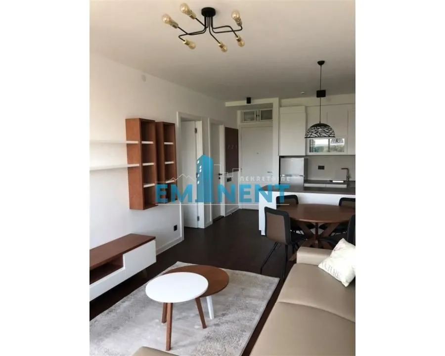 Living room connected with the dining area and kitchen.