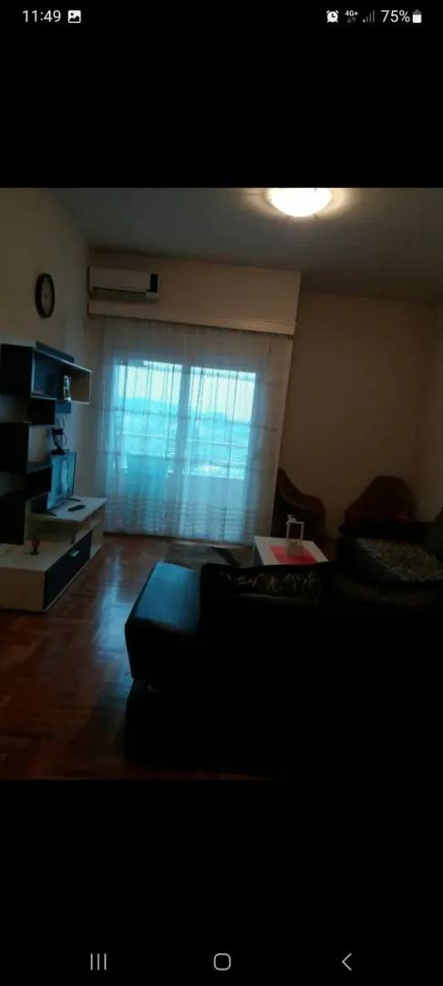 Living room with furniture and TV.