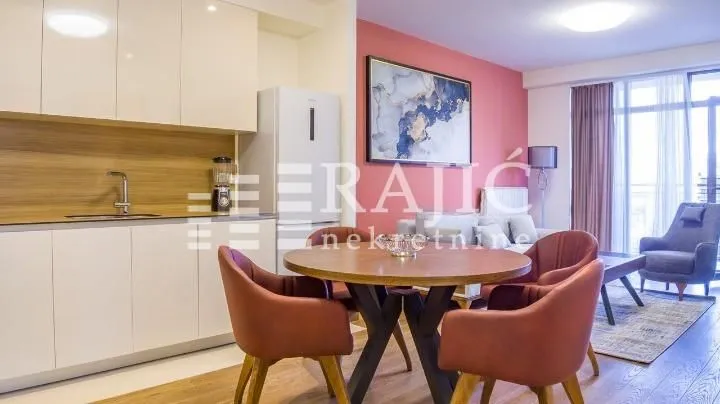 Modern living room with dining area and kitchen.