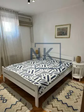 Bedroom with a white double bed and nightstands. - image 5