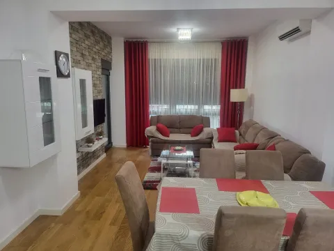 Living room with a dining table and sofa set. - image 3