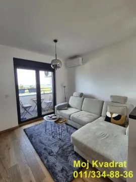 Living room with a sofa and access to the terrace. - image 3