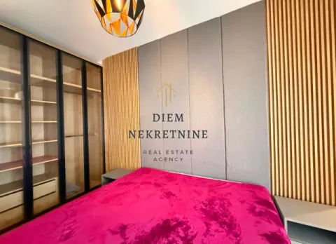 Modern bedroom with a double bed, large wardrobe, and wooden wall panels. - image 13