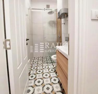 View of a modernly equipped bathroom with a shower cabin. - image 7