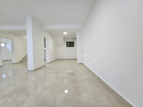 Empty and bright room with tiled flooring and white walls. - image 38