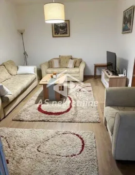 Living room with seating furniture, coffee table and television. - image 13