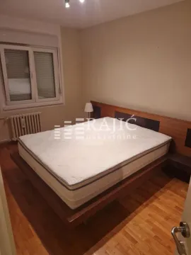 Furnished bedroom with a double bed. - image 7