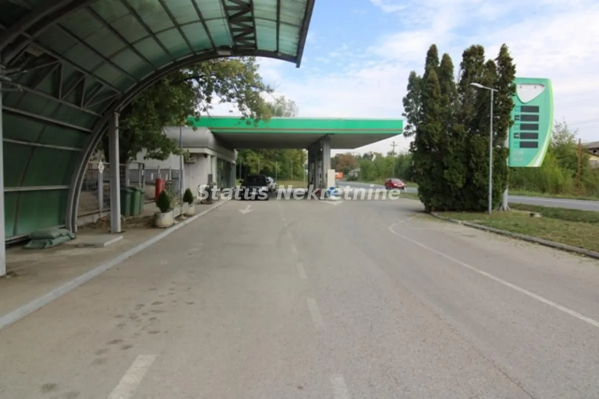 View of the exterior area of a gas station with a covered section.
