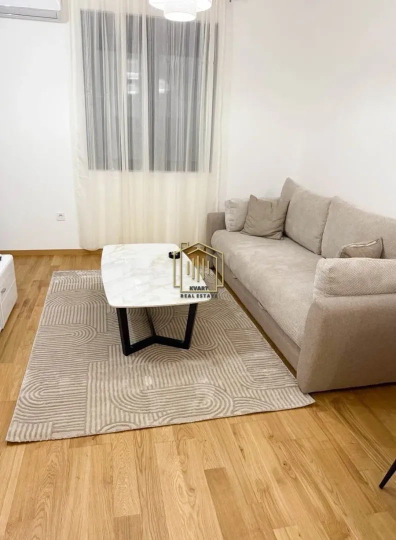 Living room with a comfortable sofa and a coffee table.