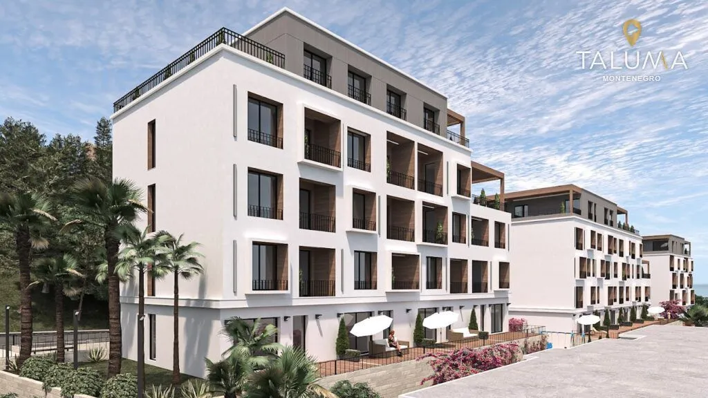 Spoljašnji izgled moderne stambene zgrade sa terasama i uređenim okruženjem.