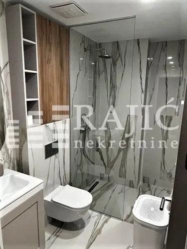 Modern equipped bathroom with a walk-in shower.