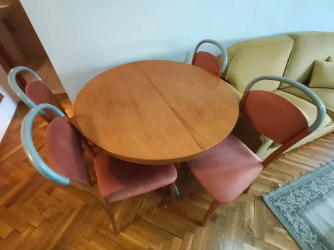 Living room with a dining table, chairs, and a sofa. - image 14