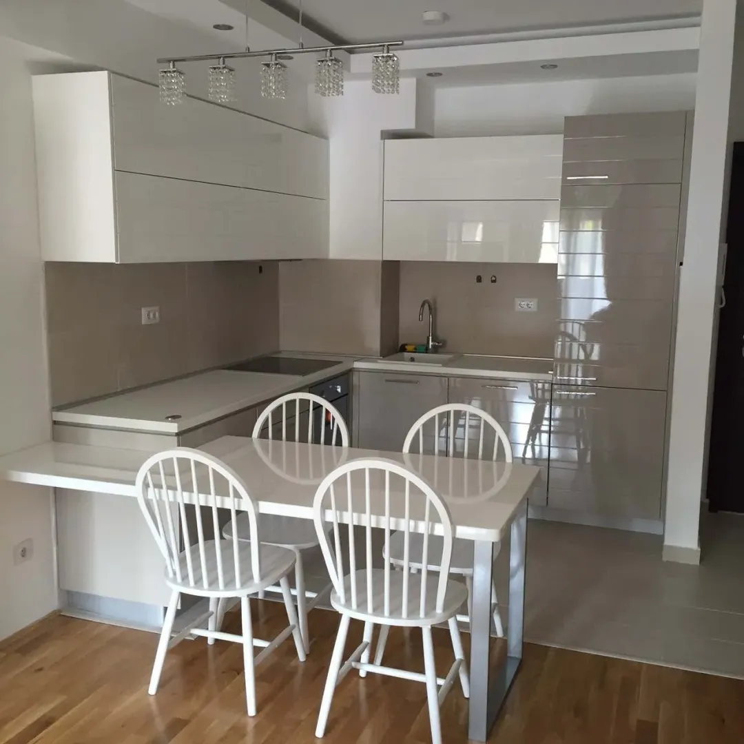 Bright kitchen with a dining table and chairs.