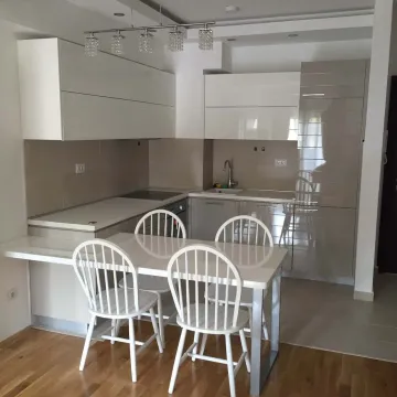 Bright kitchen with a dining table and chairs. - image 13