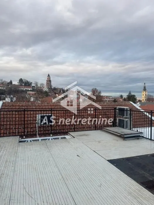 View from the terrace overlooking rooftops and the city.