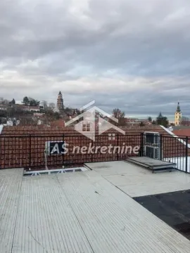View from the terrace overlooking rooftops and the city. - image 21