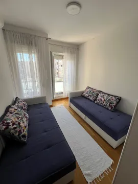 Living room with two sofas and access to the terrace. - image 7