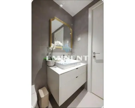Modern bathroom with a washbasin, mirror and grey tiles. - image 18