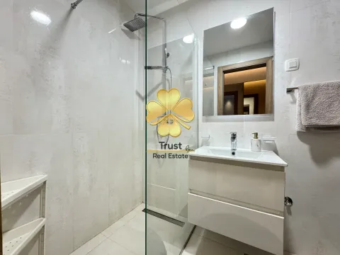 Modern bathroom with a walk-in shower and a vanity unit. - image 8