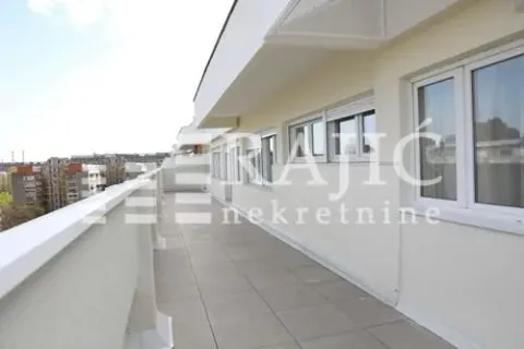 Spacious terrace with a view of surrounding buildings. - image 14