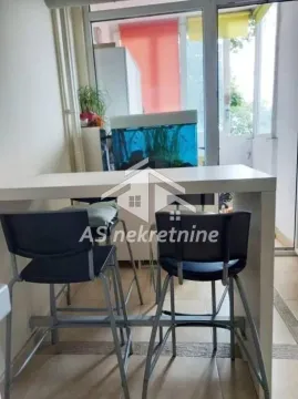 Dining table with bar stools in a bright interior. - image 5