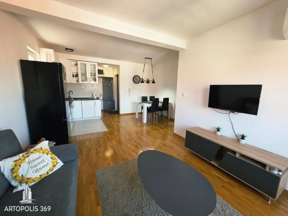 Living room connected to the dining area and kitchen.