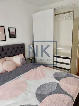 Bedroom with a double bed and a fitted wardrobe. - image 7