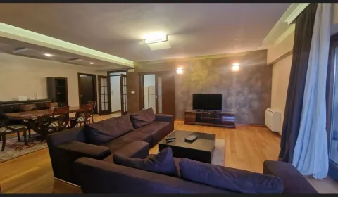 Spacious living room with a seating area and dining space. - image 2