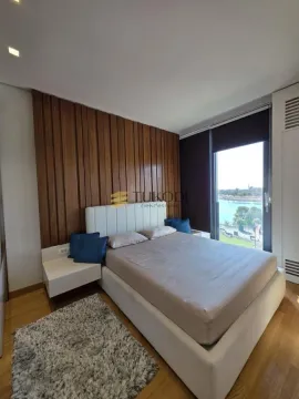 Modern bedroom with a double bed and a river view. - image 12