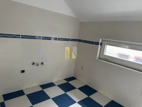 Empty bathroom tiled with ceramic tiles and a window. - image 6