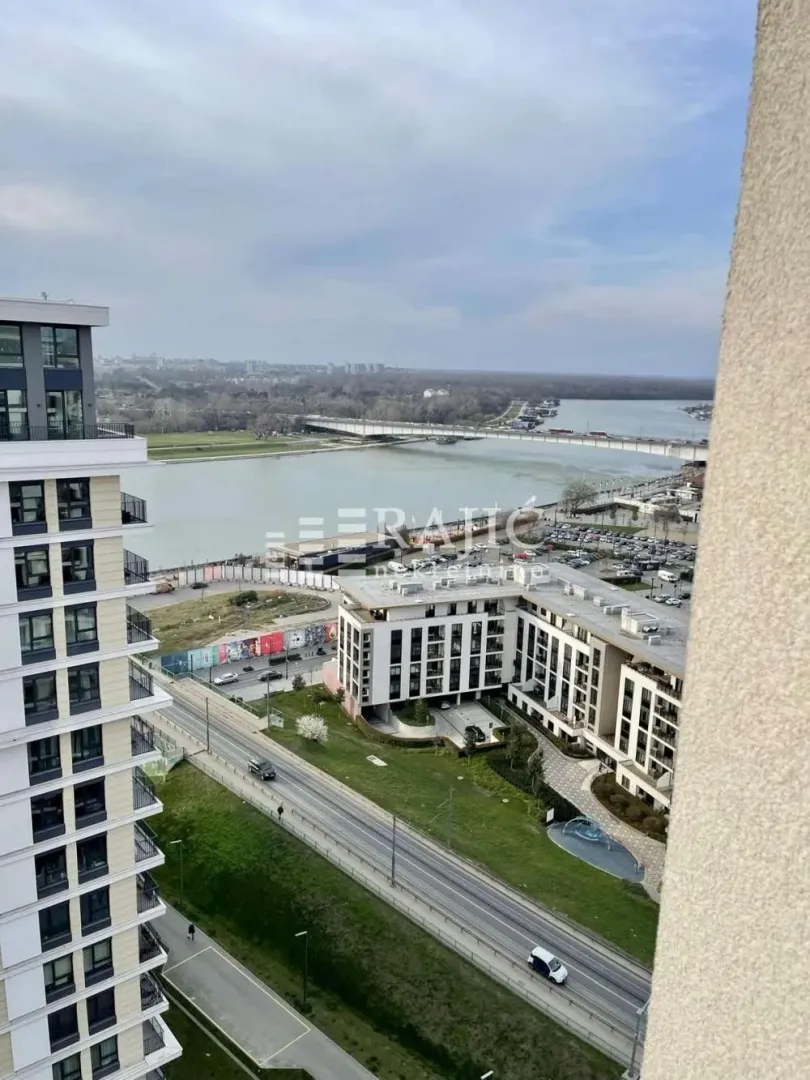 View from the terrace overlooking the river and surrounding buildings.