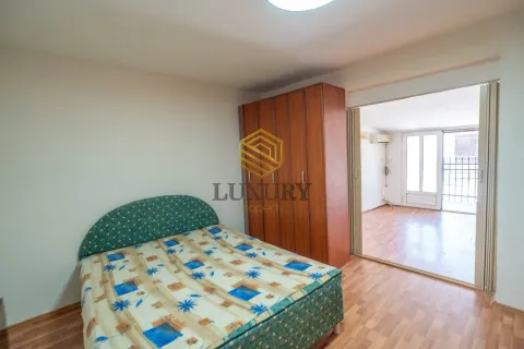 Bedroom with a double bed, wooden wardrobe, and a view of the adjacent room. - image 2