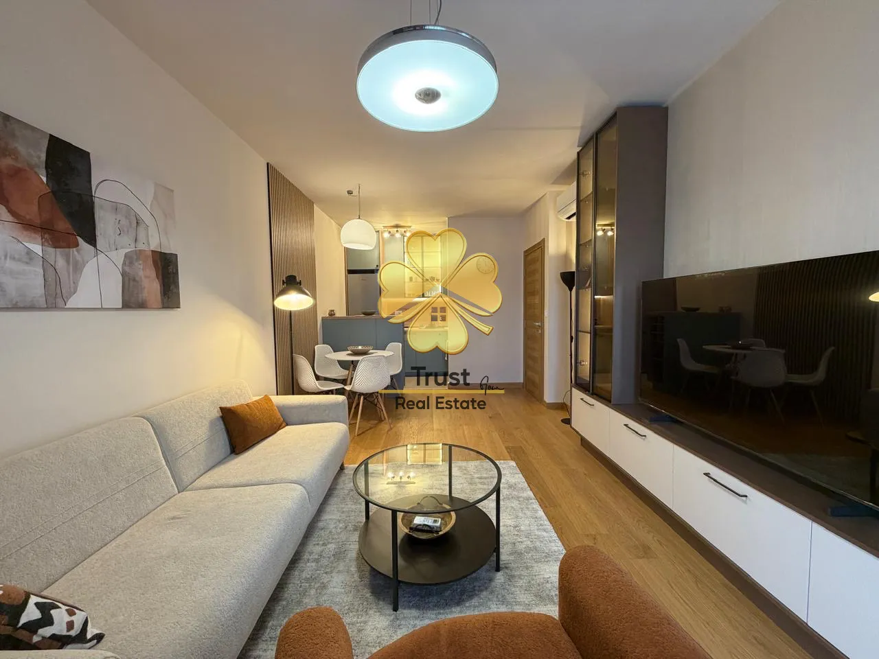 Modern living room connected to the dining area.