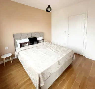 Furnished bedroom with a double bed. - image 9