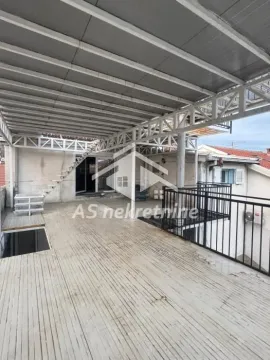 Large covered terrace with a metal structure and stairs. - image 18