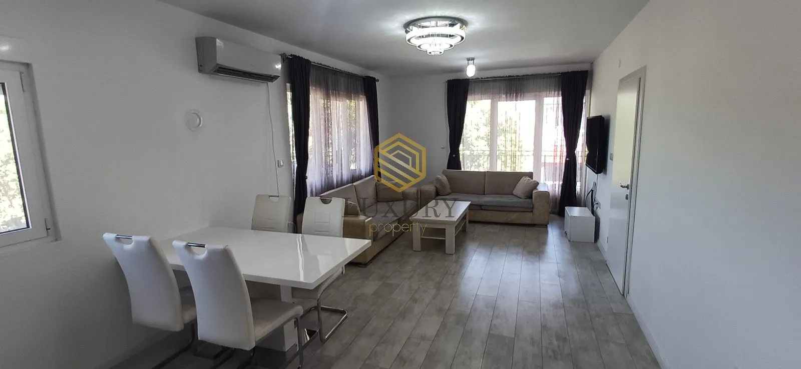 Spacious living room with a dining area and seating set.