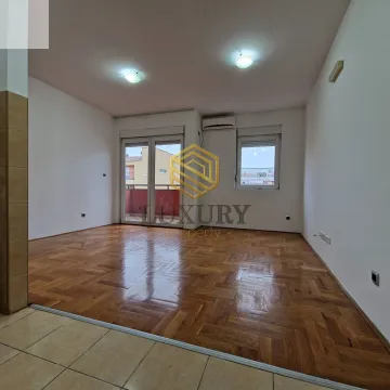 Empty living room with hardwood floors and terrace access. - image 3
