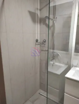 Modern bathroom with a walk-in shower and a vanity unit. - image 3