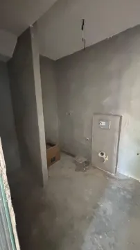 Unfurnished bathroom under rough construction with installed pipes. - image 6