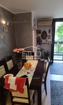 Dining area with a table, chairs, and access to the terrace. - image 8